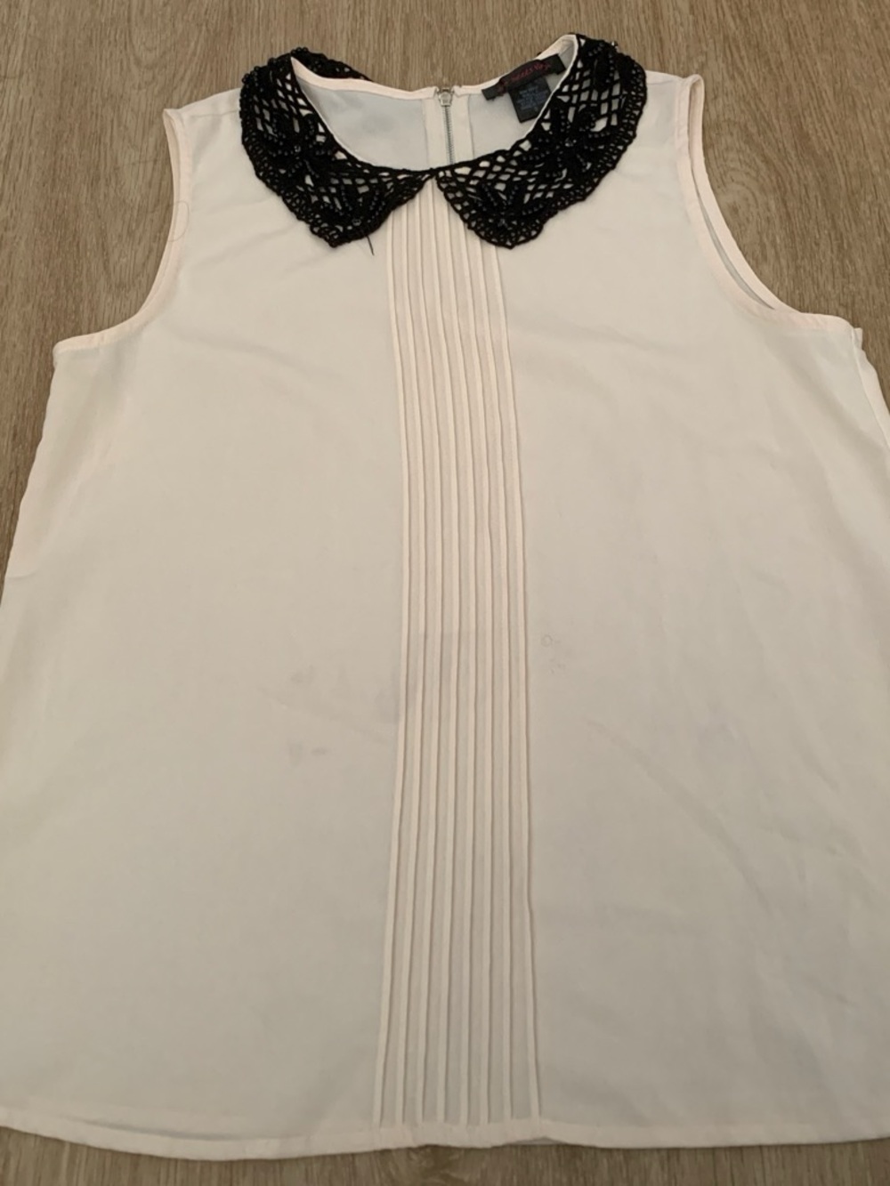 Sleeveless Cream Blouse with Black Crochet Collar embellished with beads.